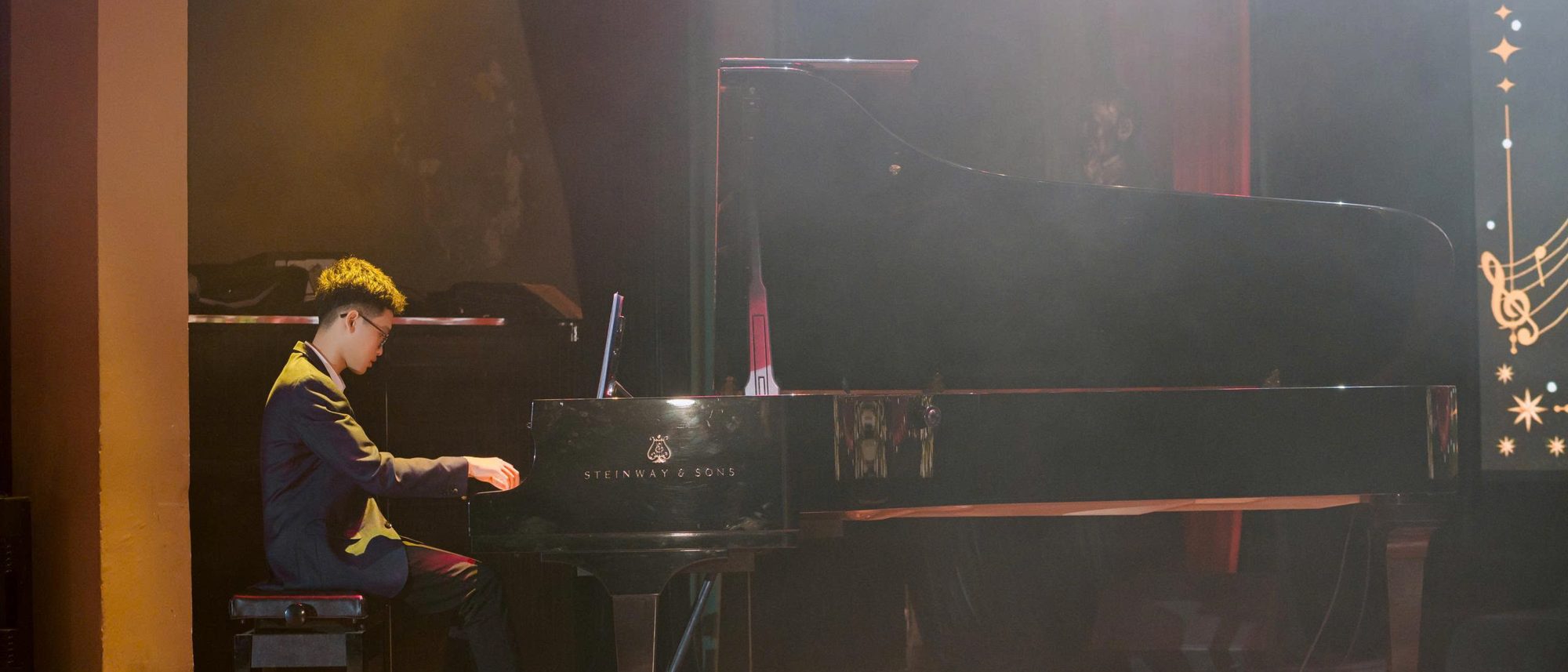 Mai Xuan Bach playing a Steinway grand piano on stage