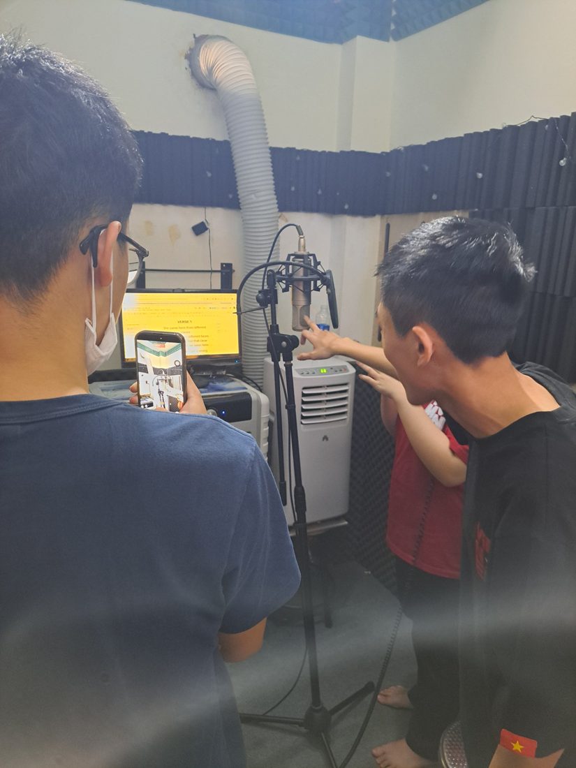 Setting up the mic, with the lyrics on screen.